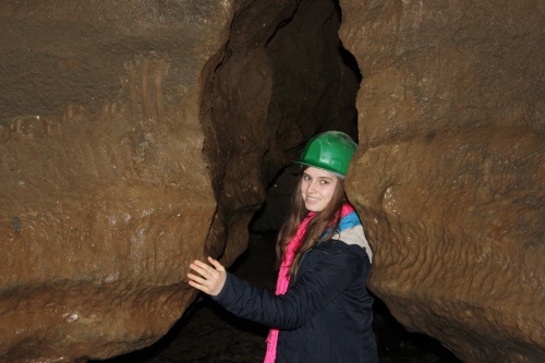 Going through a passageway in the Doolin Cave. 